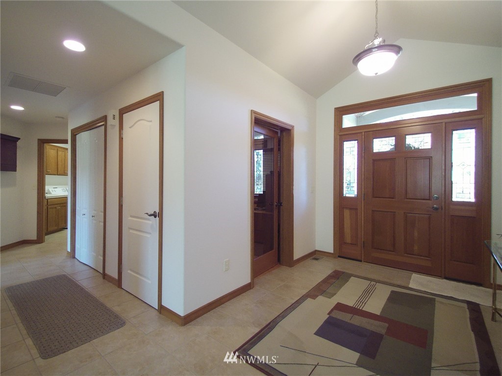247 Jake Way Sequim, WA 98382 - Photo 21 of 40 a spacious bathroom with a mirror and a shower