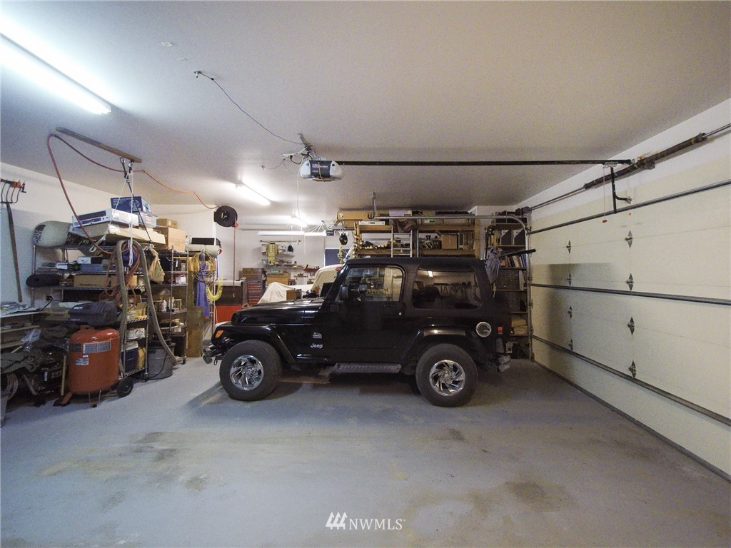 247 Jake Way Sequim, WA 98382 - Photo 34 of 40 a view of a garage with parked cars