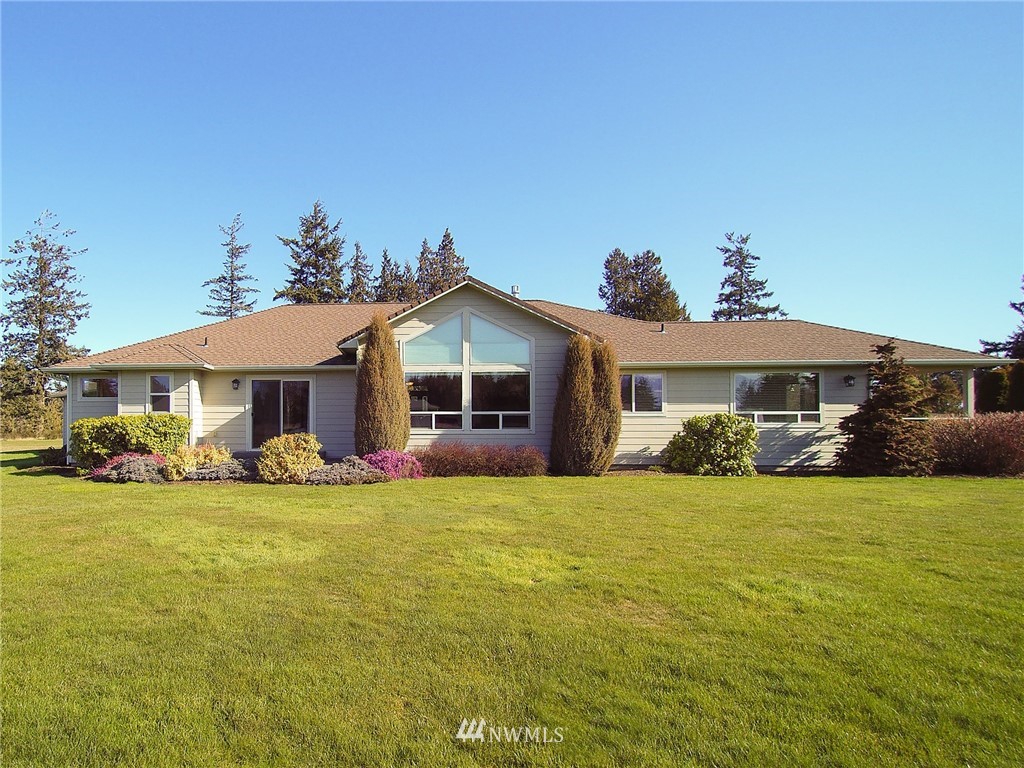 247 Jake Way Sequim, WA 98382 - Photo 37 of 40 a front view of a house with a garden