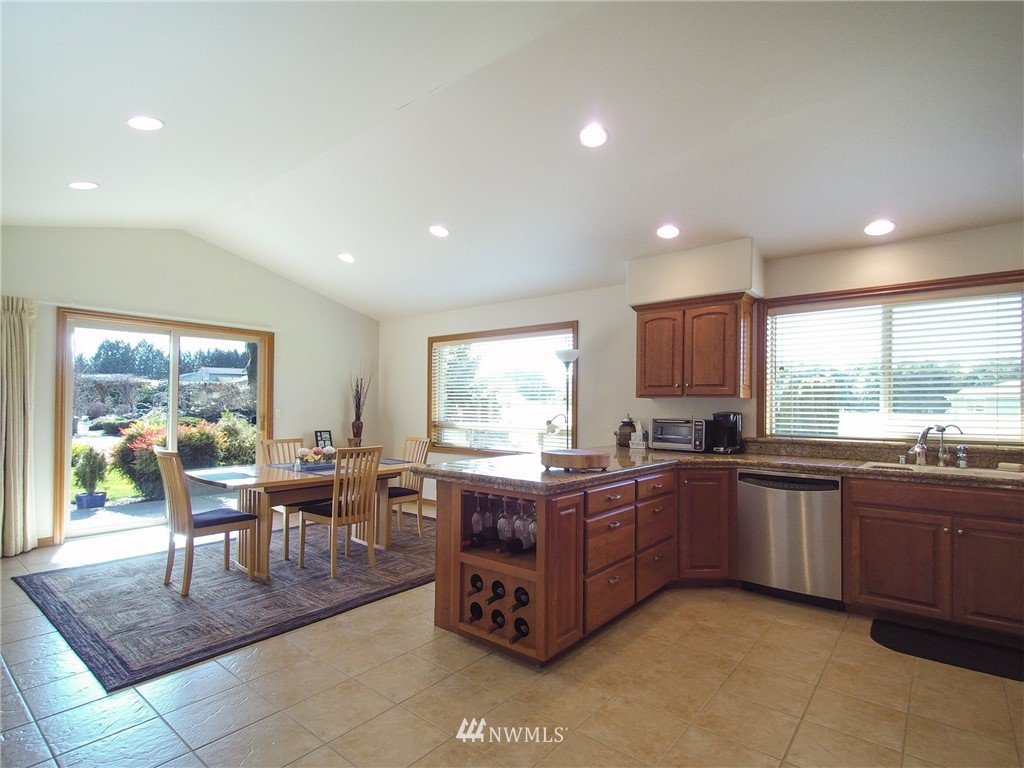 247 Jake Way Sequim, WA 98382 - Photo 6 of 40 a large kitchen with lots of table and chairs