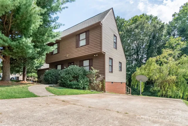 a front view of a house with a yard and a garage