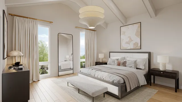 a spacious bedroom with a bed and a chandelier