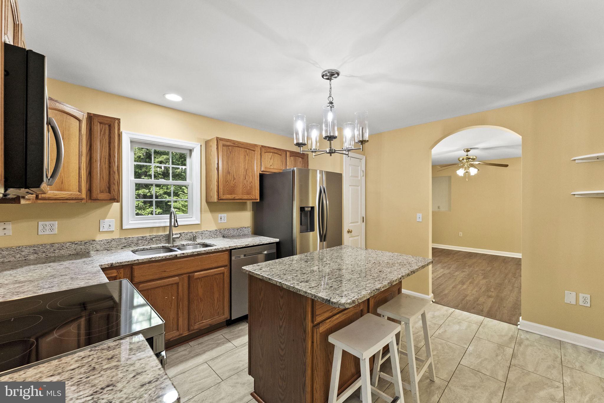 20065 Crooked Run Road Culpeper, VA 22701 - Photo 17 of 62 a kitchen with a sink a counter space and wooden floor