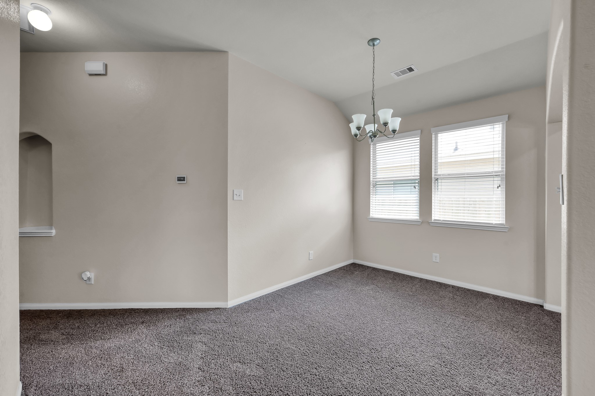 3532 Korina Way Conroe, TX 77306 - Photo 12 of 34 a view of a room with window and chandelier fan