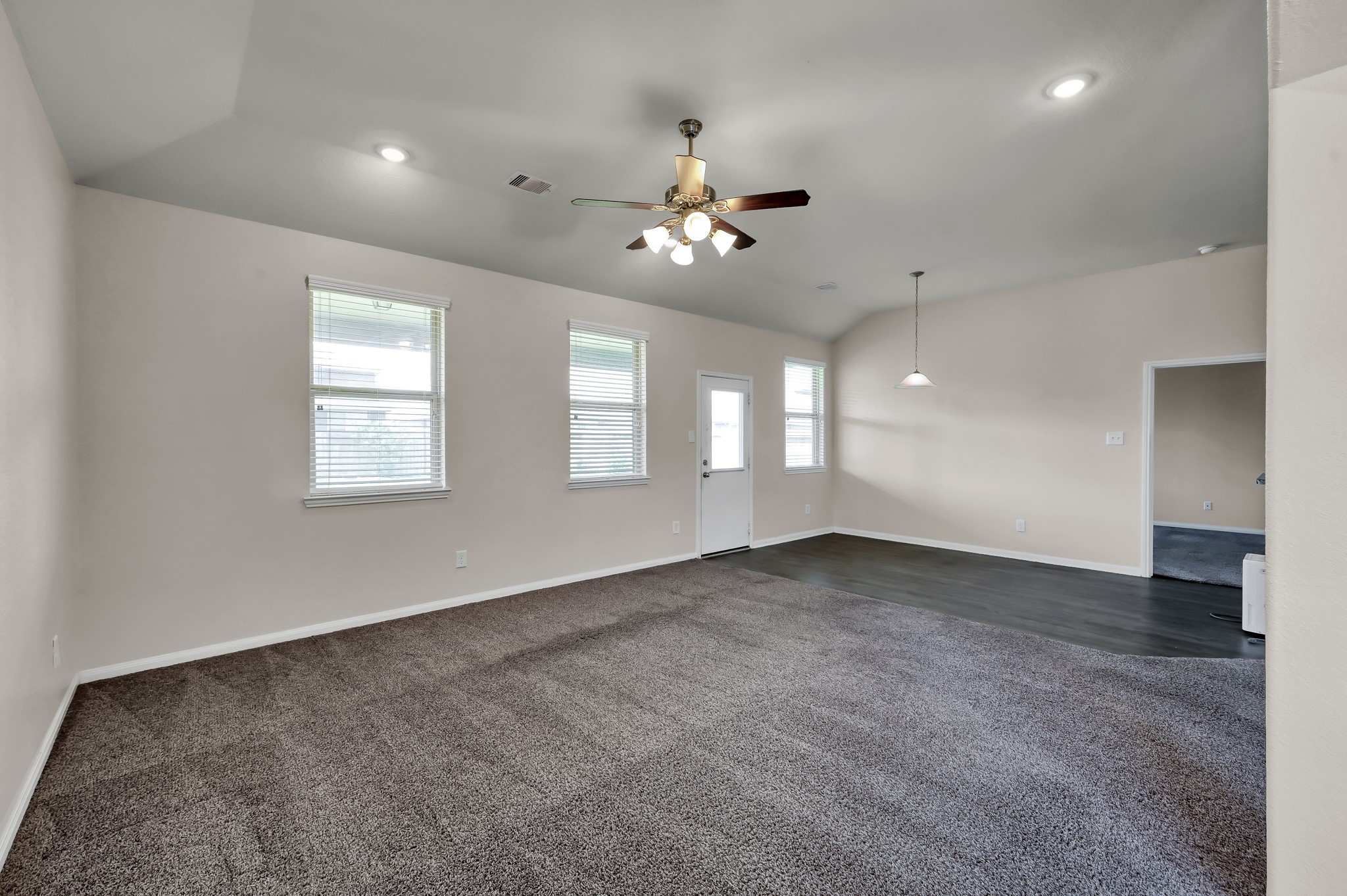 3532 Korina Way Conroe, TX 77306 - Photo 14 of 34 an empty room with windows and ceiling fan
