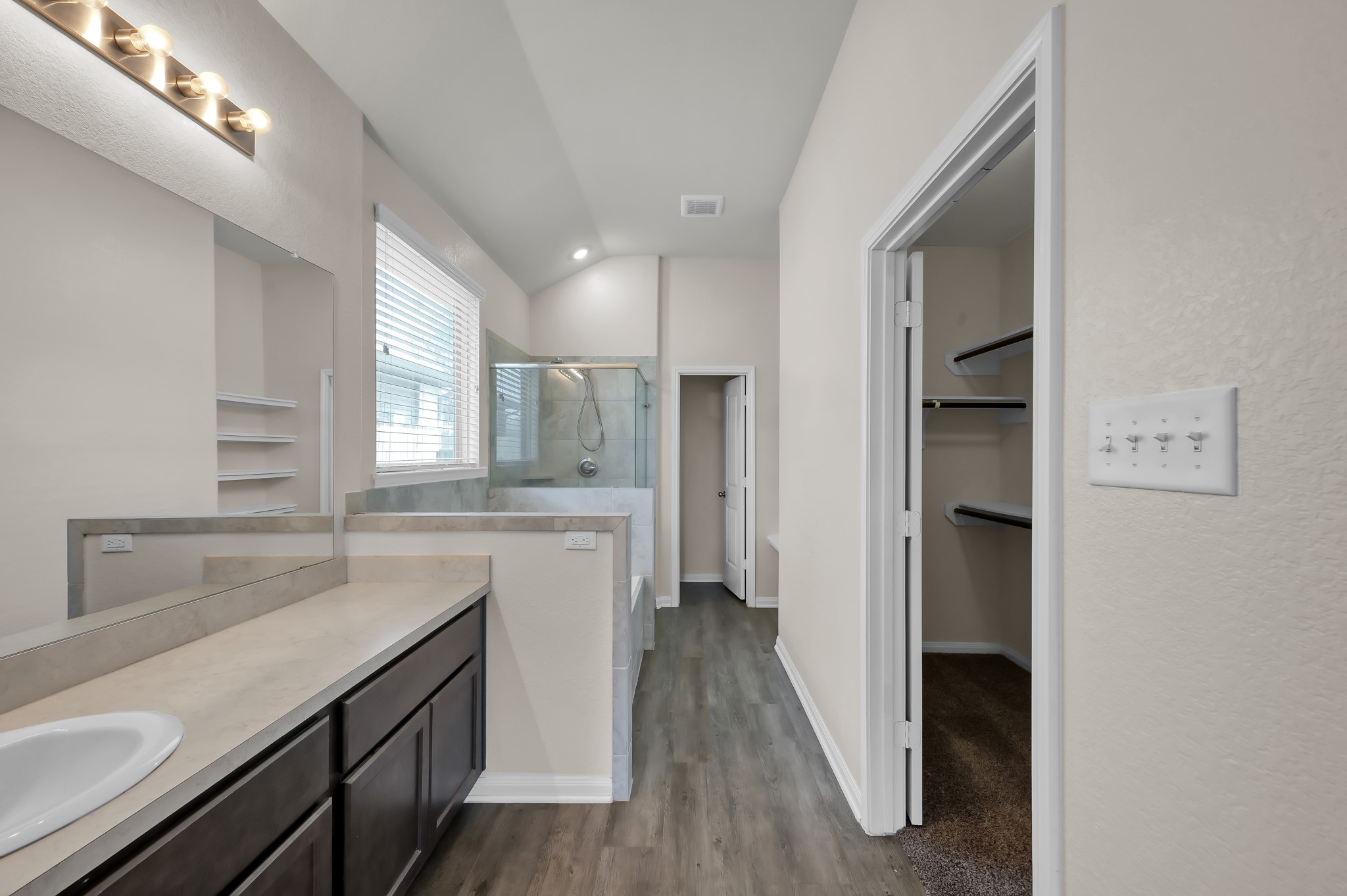 3532 Korina Way Conroe, TX 77306 - Photo 22 of 34 a kitchen with a sink cabinets stainless steel appliances and a window