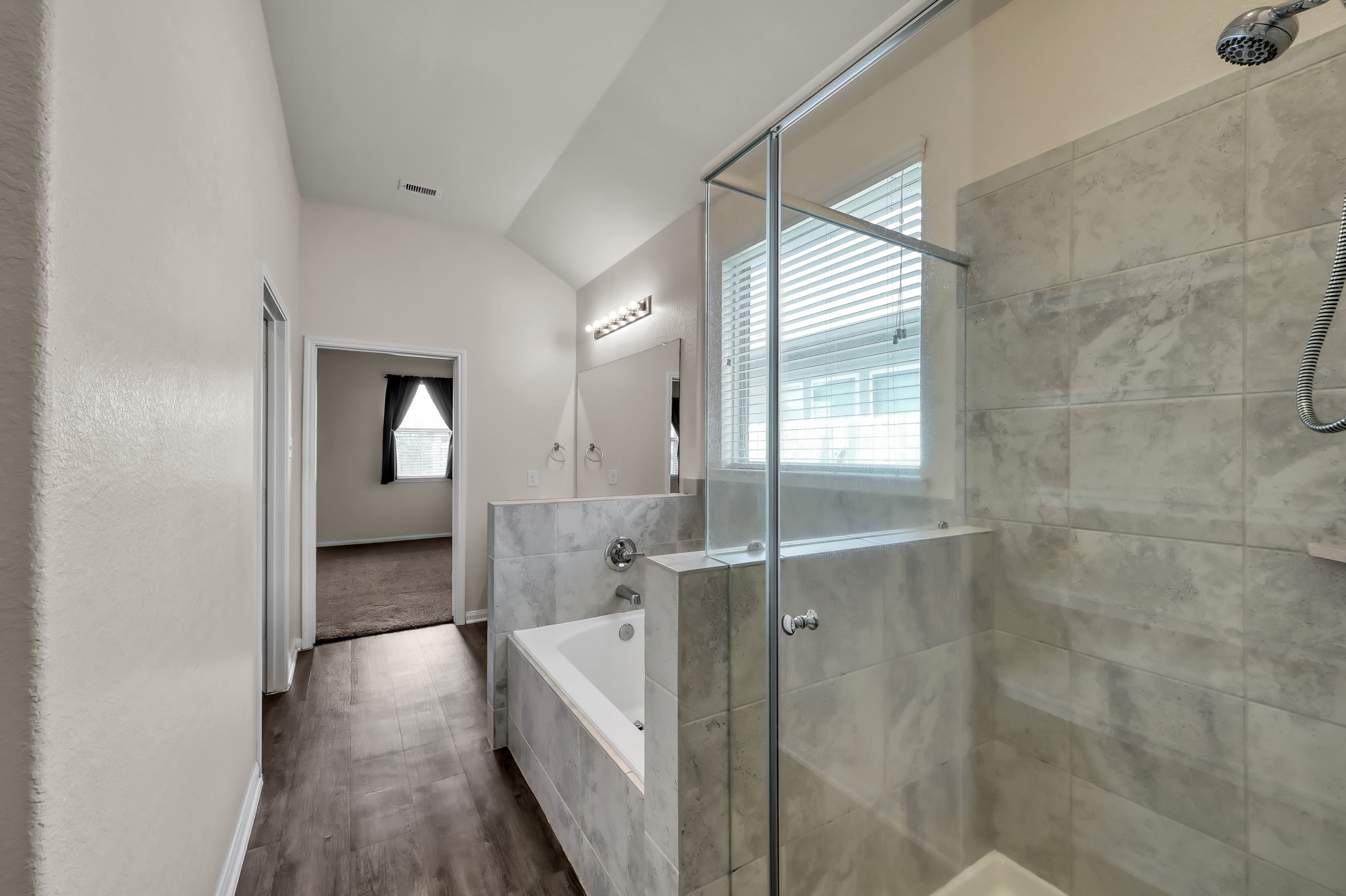3532 Korina Way Conroe, TX 77306 - Photo 23 of 34 a bathroom with a glass shower door and a sink