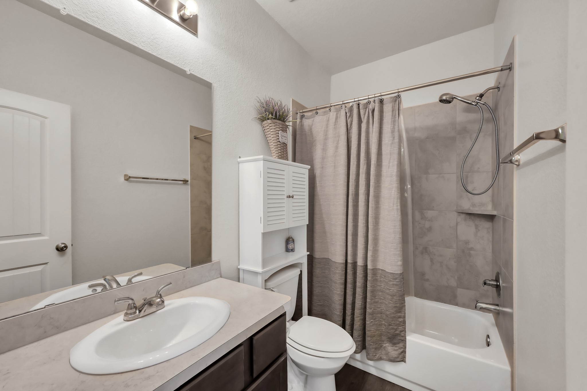 3532 Korina Way Conroe, TX 77306 - Photo 26 of 34 a bathroom with a sink toilet and shower