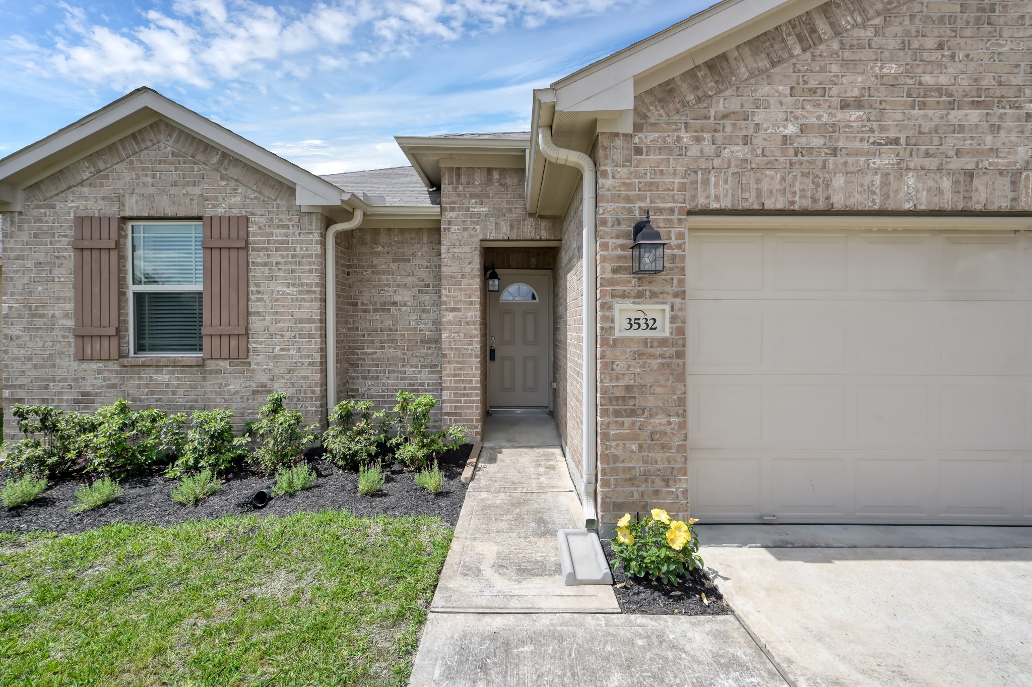 3532 Korina Way Conroe, TX 77306 - Photo 3 of 34 a front view of a house with potted plants