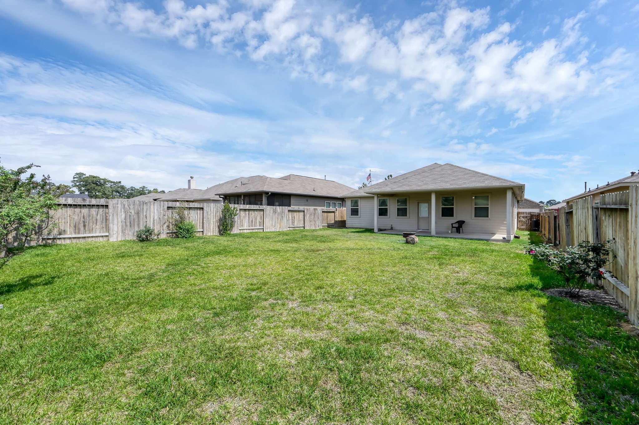 3532 Korina Way Conroe, TX 77306 - Photo 33 of 34 a front view of house with yard and green space