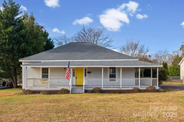 a backyard of a house with yard fire pit barbeque oven and outdoor seating