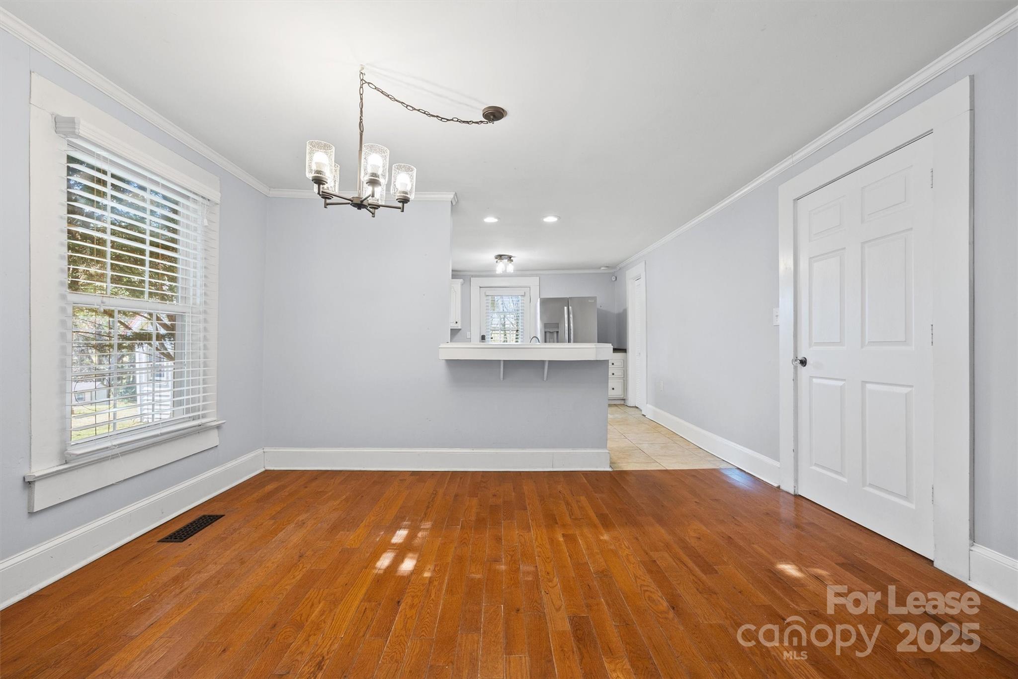 512 Banks Street Fort Mill, SC 29715 - Photo 14 of 30 a view of a room with wooden floor and windows
