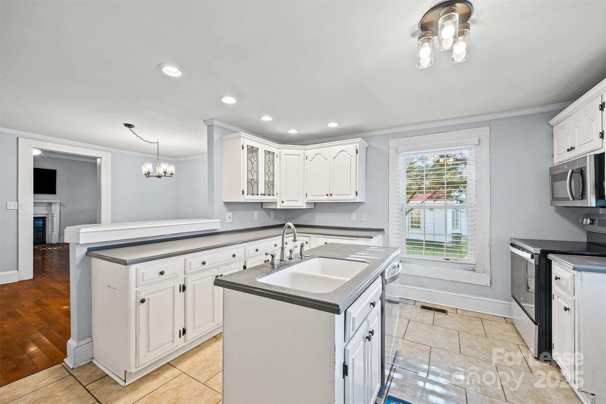 512 Banks Street Fort Mill, SC 29715 - Photo 17 of 30 a kitchen with a sink stove and cabinets