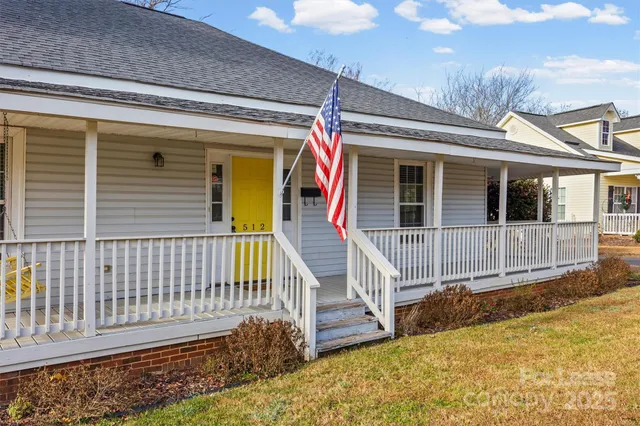 a view of a house with wooden deck