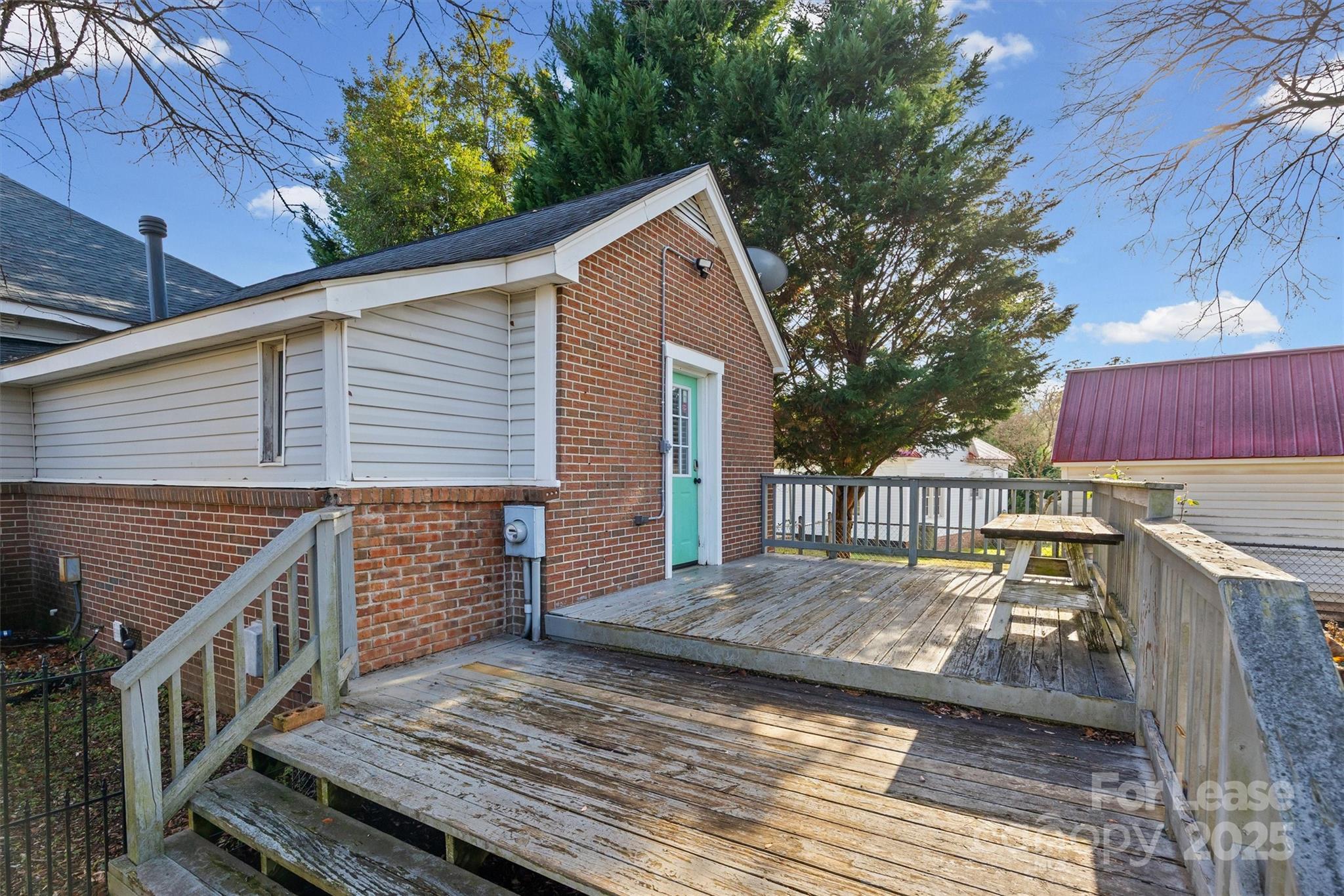 512 Banks Street Fort Mill, SC 29715 - Photo 25 of 30 a view of a wooden deck with a yard