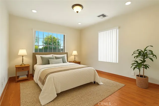 a bedroom with bed and a window