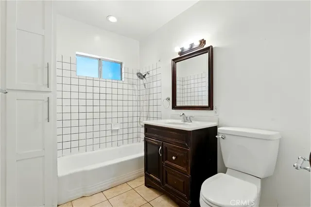 a bathroom with a toilet a sink and bathtub