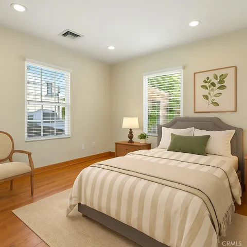 a bedroom with a bed and a couch