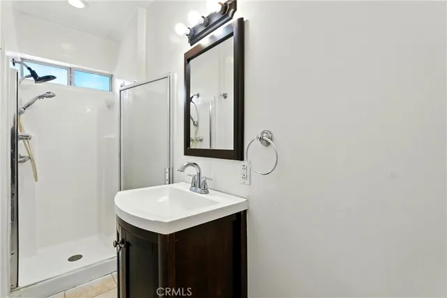a bathroom with a sink and mirror