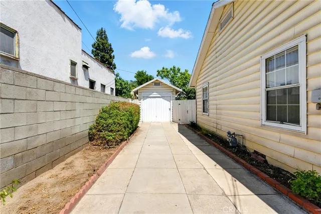 an aerial view of multiple houses with outdoor space