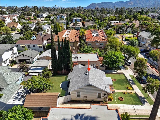 an aerial view of house with yard