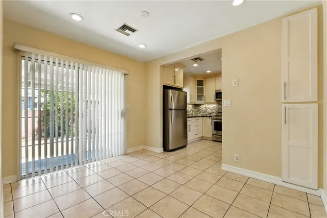 a view of a kitchen with a refrigerator
