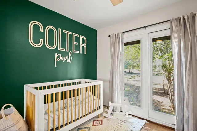 a bedroom with furniture and a window