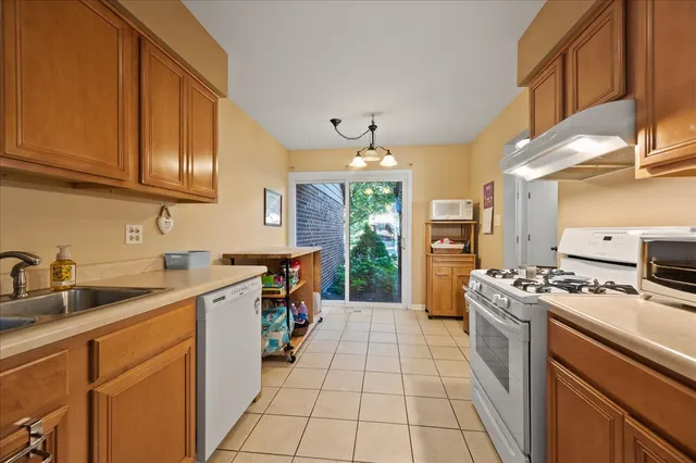 a kitchen with stainless steel appliances granite countertop a stove and a sink