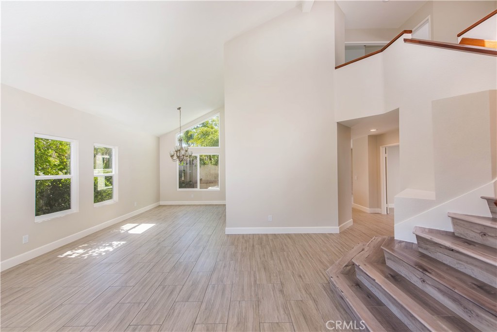 17 Palermo Irvine, CA 92614 - Photo 3 of 17 a view of a room with wooden floor and window