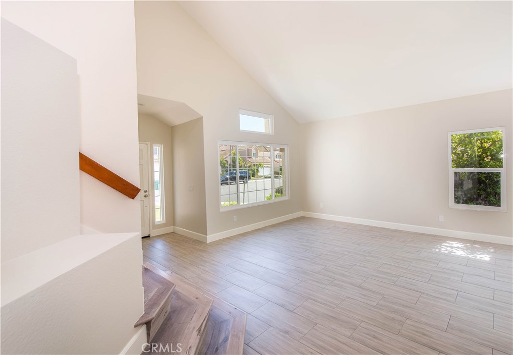 17 Palermo Irvine, CA 92614 - Photo 4 of 17 an empty room with wooden floor and windows