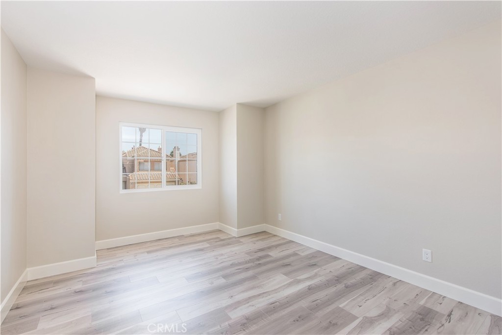 17 Palermo Irvine, CA 92614 - Photo 10 of 17 an empty room with wooden floor and windows