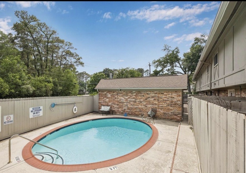 515 Tallowood Road, Unit 55 Houston, TX 77024 - Photo 17 of 18 a view of outdoor space swimming pool