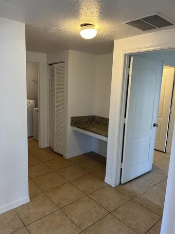 a view of kitchen and utility room