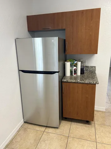 a white refrigerator freezer sitting in a kitchen