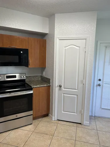 a kitchen with a stove and a microwave