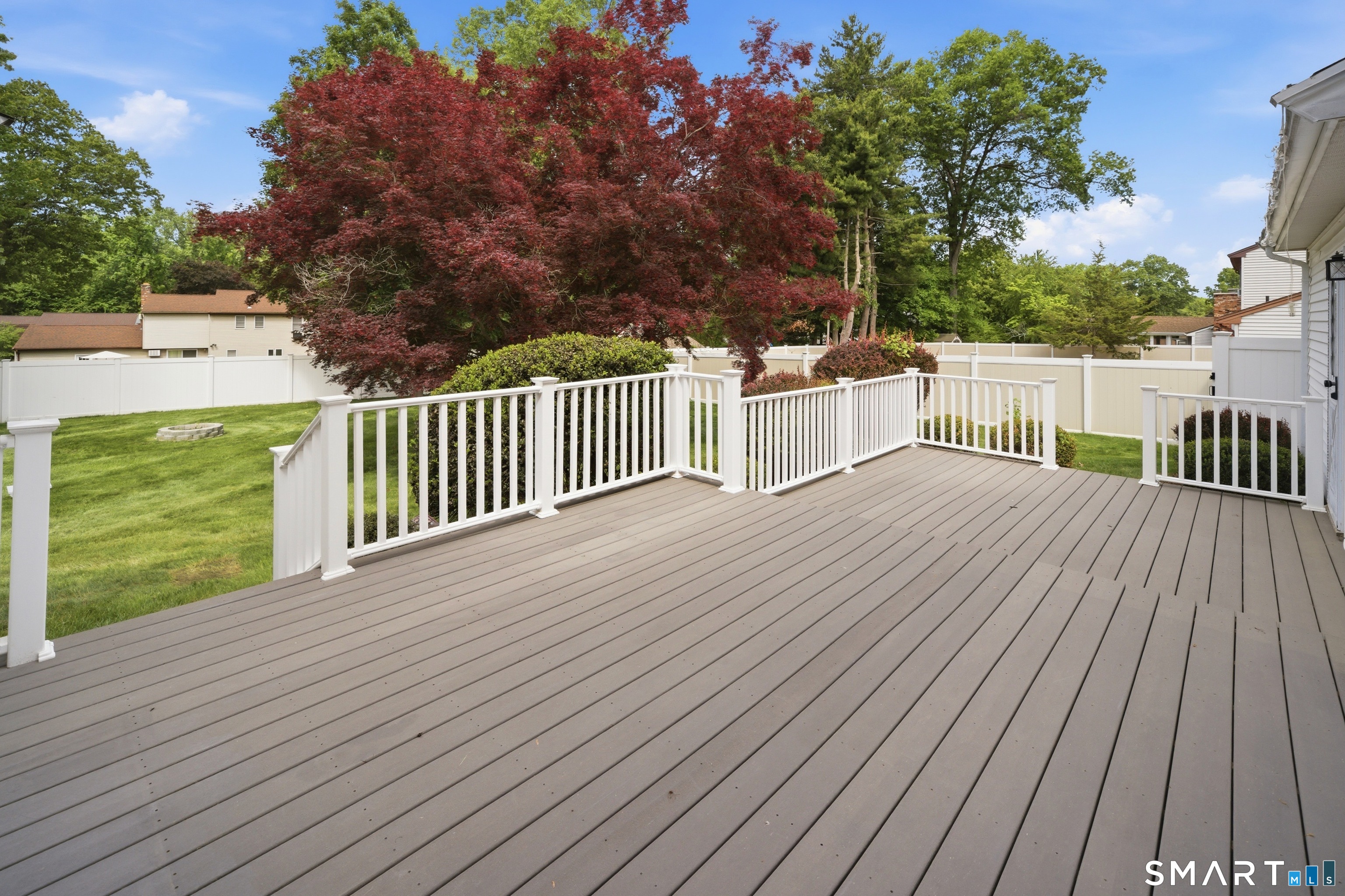 211 Valley View Road Manchester, CT 06040 - Photo 34 of 39 a balcony with wooden floor and fence