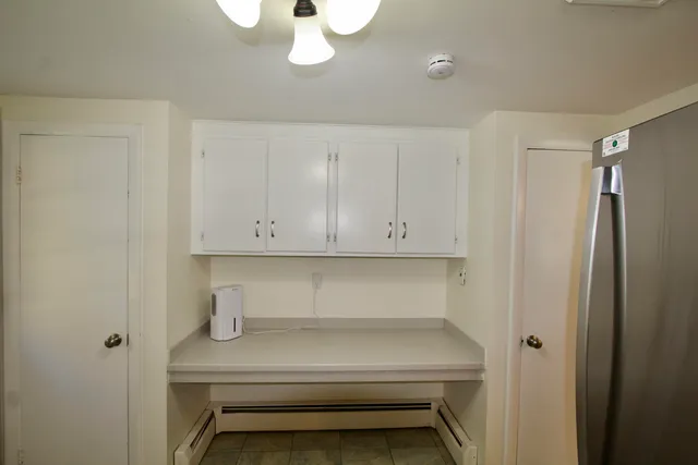 a view of room with racks on the wall