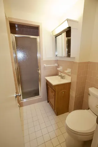 a bathroom with a sink a toilet and mirror