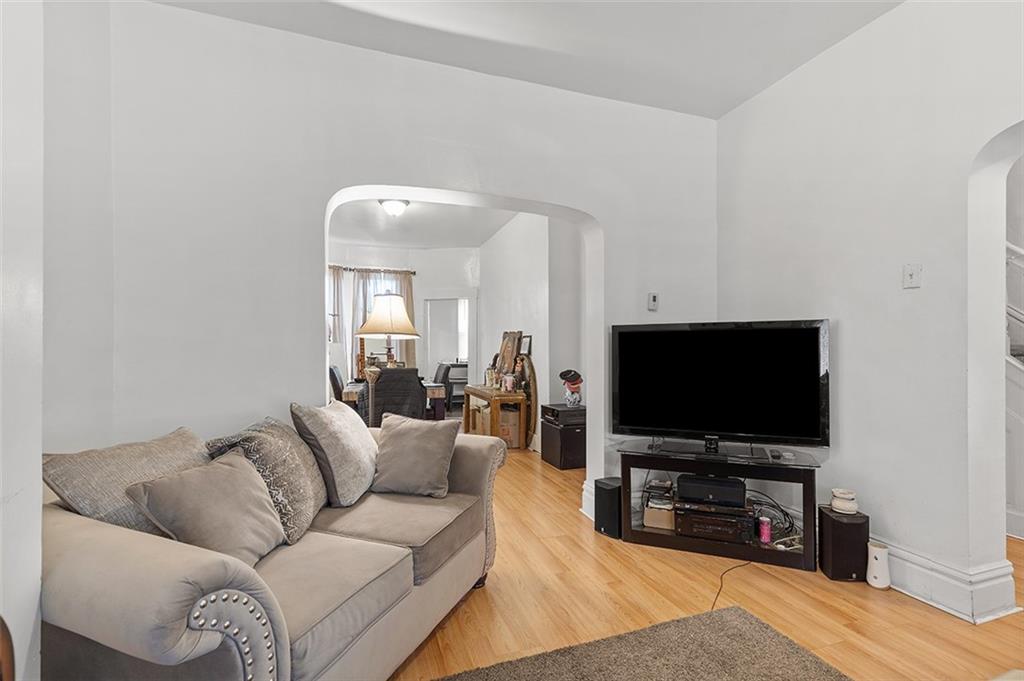 3124 Universal Street Pittsburgh, PA 15204 - Photo 17 of 30 a living room with furniture and a flat screen tv