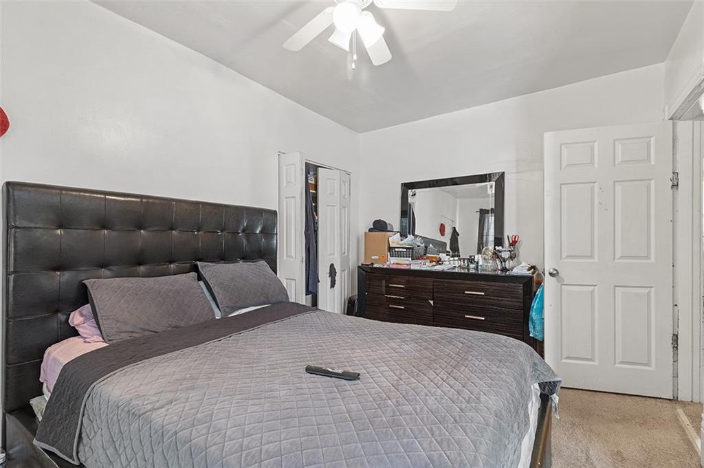 3124 Universal Street Pittsburgh, PA 15204 - Photo 20 of 30 a bedroom with a bed and a mirror on dresser