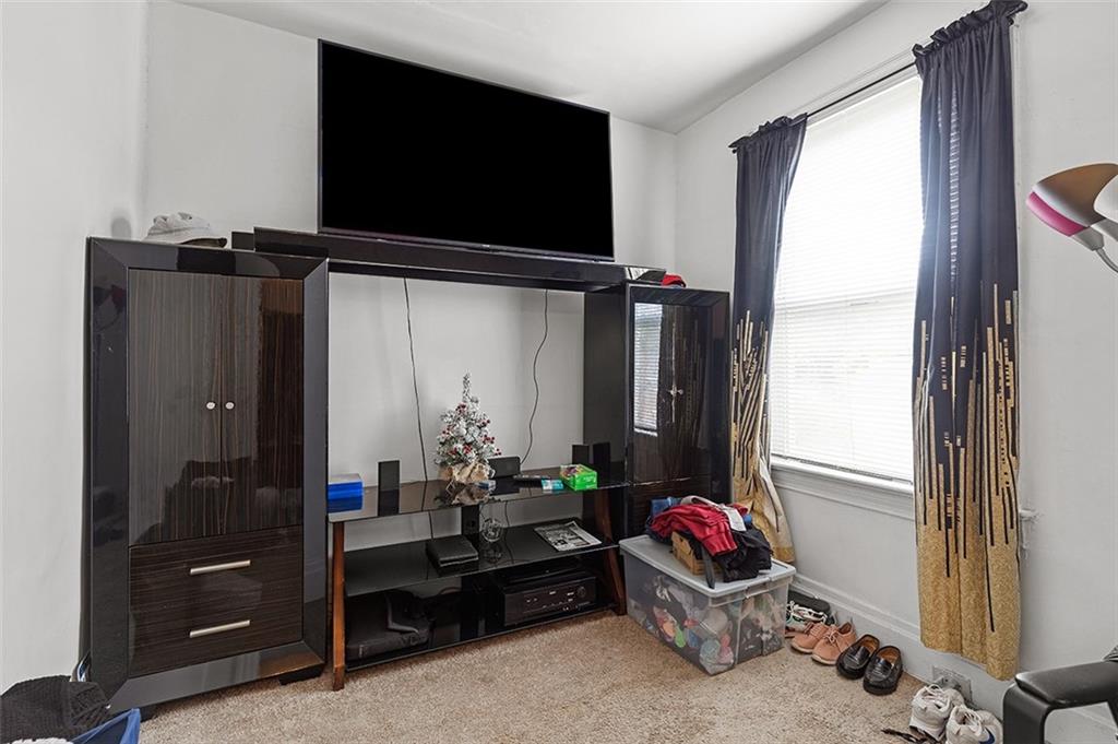 3124 Universal Street Pittsburgh, PA 15204 - Photo 21 of 30 a living room with furniture and a flat screen tv