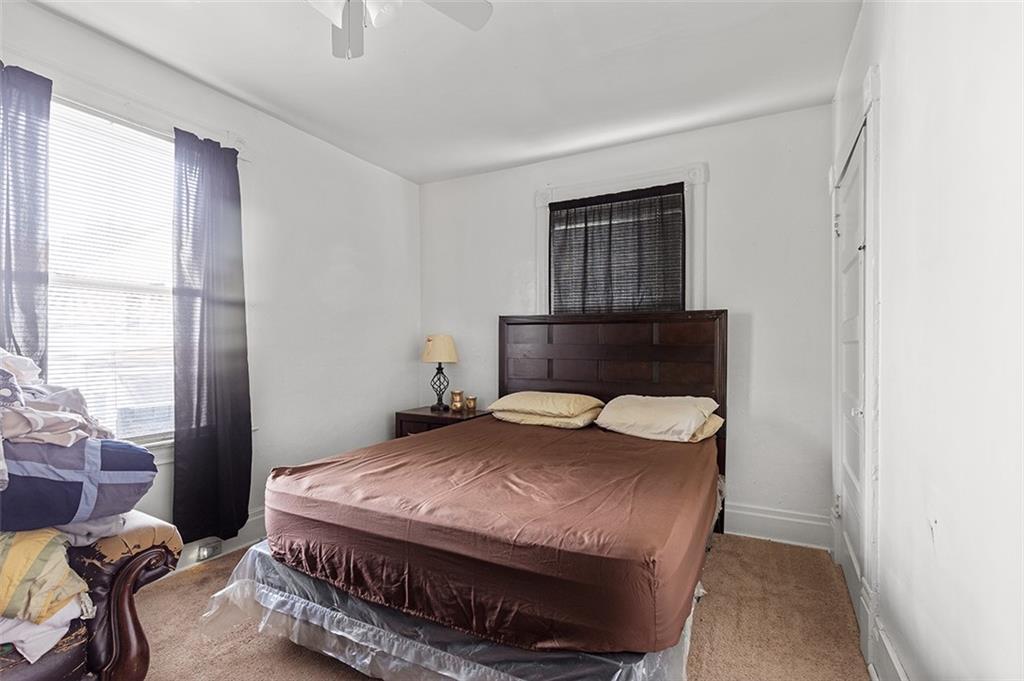 3124 Universal Street Pittsburgh, PA 15204 - Photo 23 of 30 a bedroom with a bed and wooden floor
