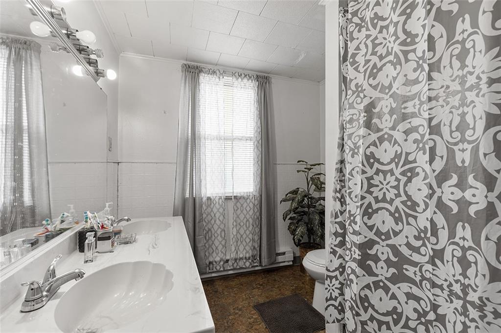 3124 Universal Street Pittsburgh, PA 15204 - Photo 24 of 30 a bathroom with a sink toilet and shower