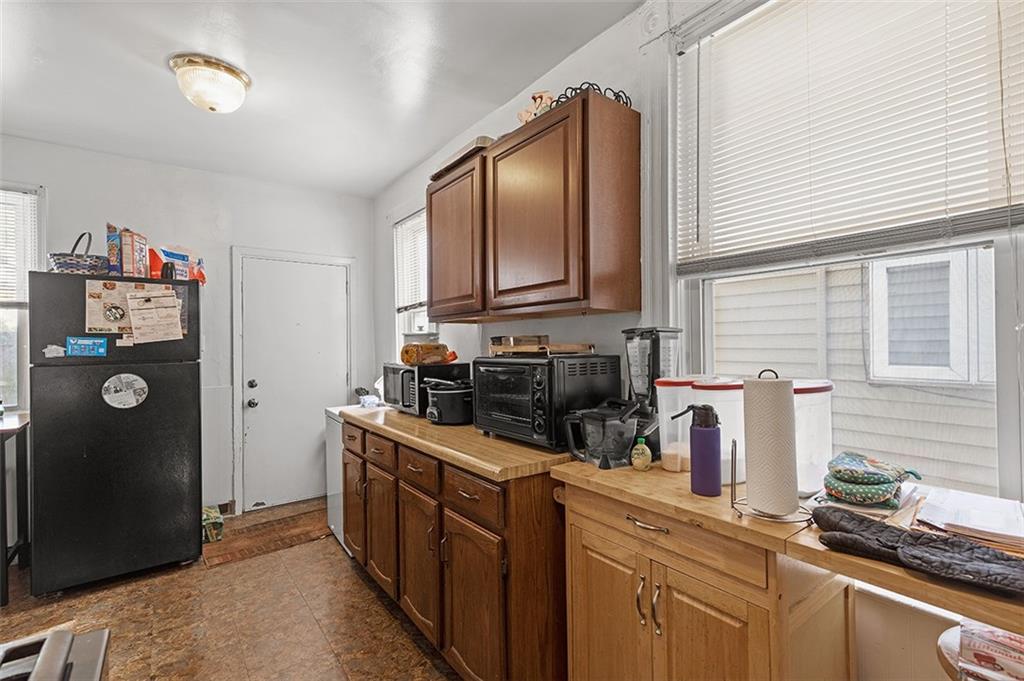 3124 Universal Street Pittsburgh, PA 15204 - Photo 10 of 30 a kitchen with sink refrigerator and microwave