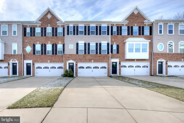 a view of a brick house with many windows
