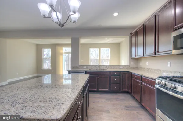 a view of a kitchen and a window