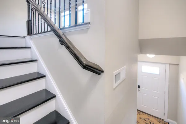 a view of empty room with a fireplace
