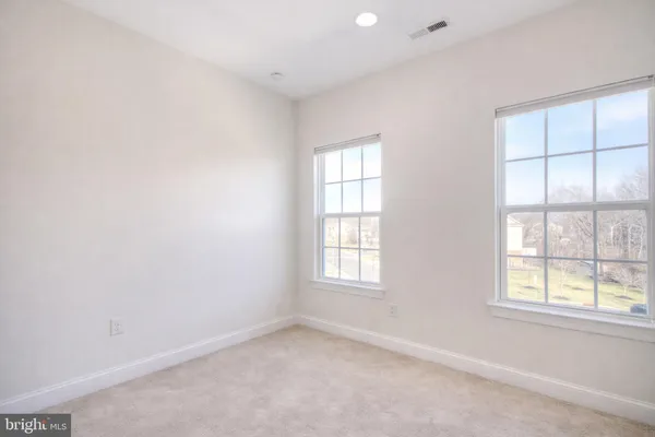 a spacious bathroom with a bathtub and shower