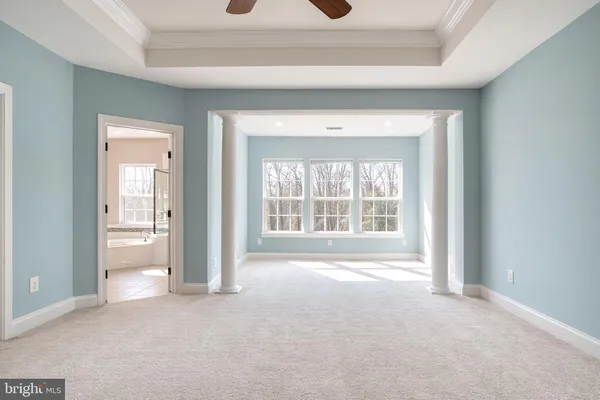 a spacious bathroom with a tub and shower