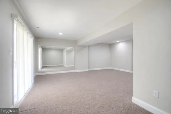 an empty room with a fireplace